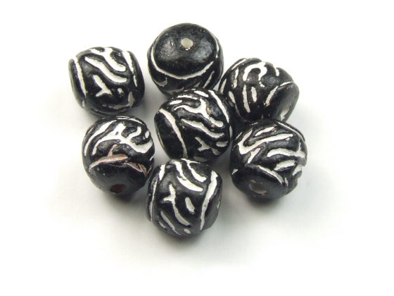 Tonperle 'Jingala Lakka', 11x10 mm, schwarz-wei